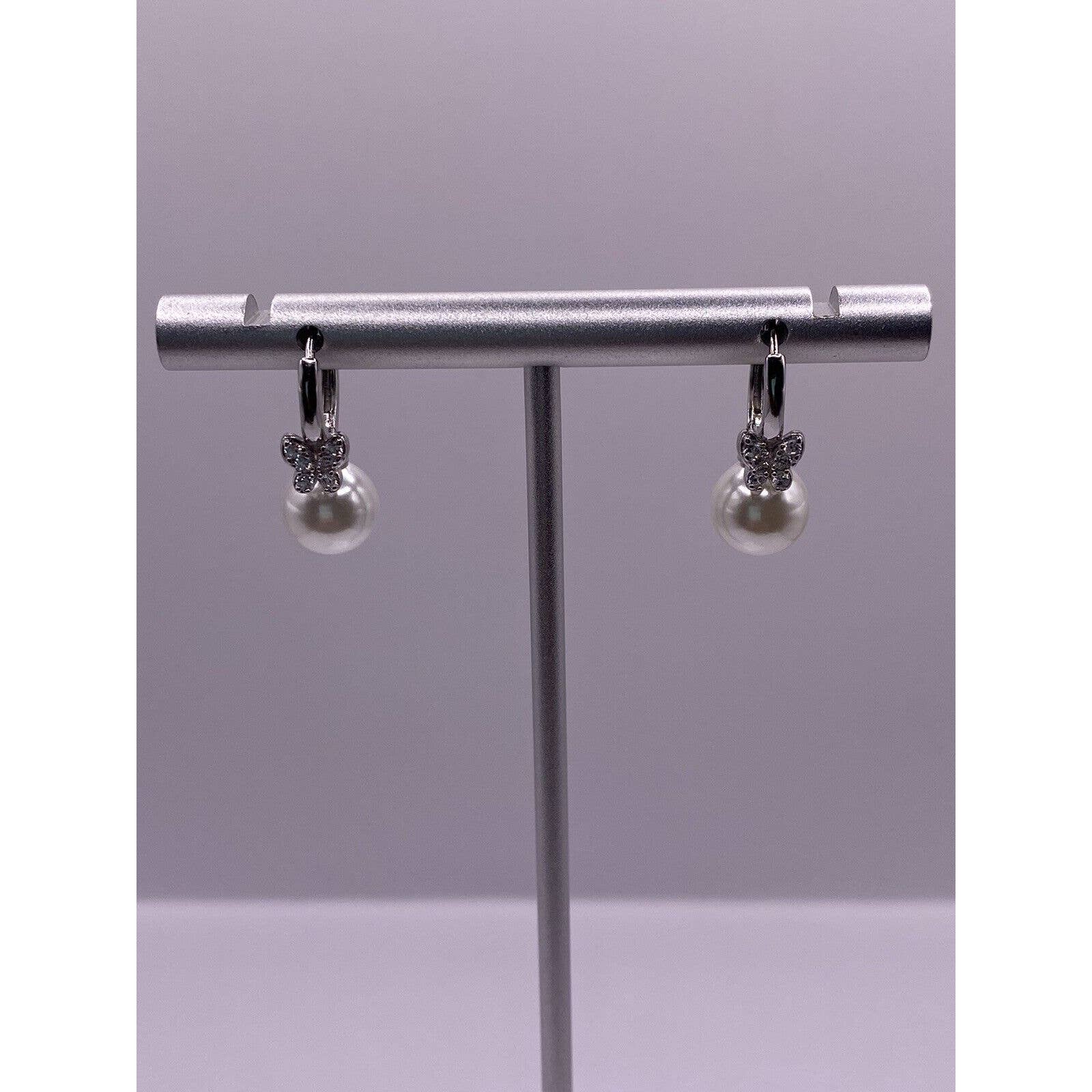 Faux Pearl Hoop Dangle With A Cz Cluster Butterfly Above Earring